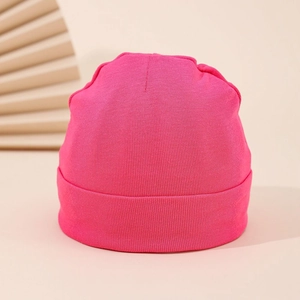 Close-up of hot pink ribbed knit newborn beanie with soft double-layer cotton fabric