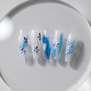 5D stereoscopic floral press-on nails with blue marble effect and 3D flower relief