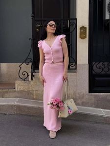 Detailed knit texture of pink V-neck button cardigan and matching ribbed maxi skirt set