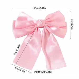 Detailed size and weight dimensions of the pink satin bow hair clip on white background
