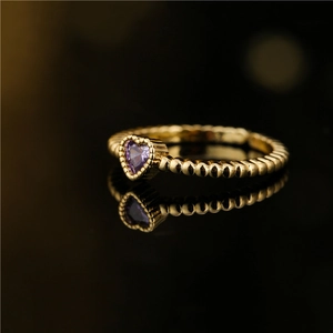 Exquisite 18K gold plated heart purple zircon ring with beaded band on black background