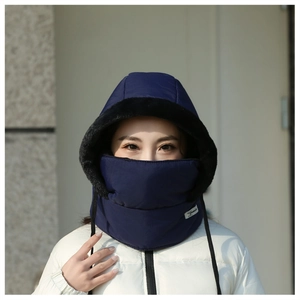 Close-up of a model wearing a navy blue winter windproof hat with integrated mask.