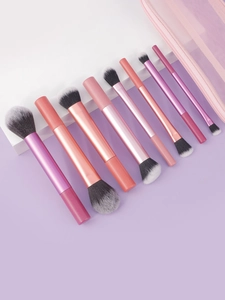 Set de 8 pinceaux de maquillage avec poils dégradés et trousse en filet rose sur socles