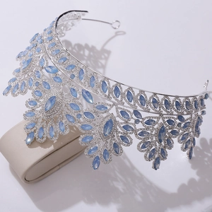 Macro view of bridal crown featuring blue marquise crystals and clear rhinestones