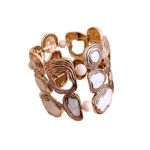 Vintage irregular gold cuff bracelet with white marble beads and enamel inlay design