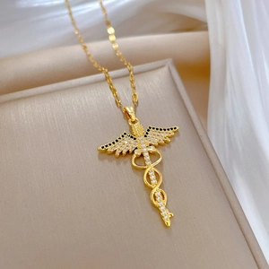 Elegant gold Caduceus pendant necklace with sparkling stones on a delicate chain