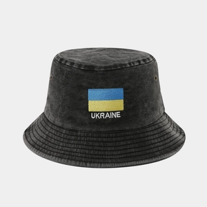 Detail of washed cotton bucket hat with Ukraine flag embroidery and metal eyelets