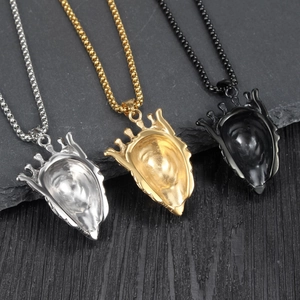 Detailed view of punk lion king crown shield pendants in silver, gold, and black colors