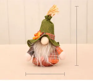 Detail view of gnome plush with autumn maple leaves and grid pattern dimensions