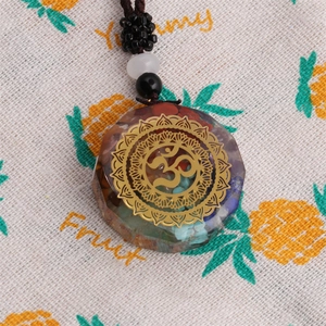Chakra Orgonite necklace pendant with rainbow crystals and golden Om symbol