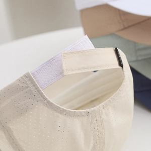 Detailed close-up of breathable mesh fabric and adjustable hook-and-loop strap on kids sun hat