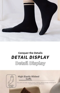 Detail view of black cotton crew socks showing high-elastic ribbed cuff for a snug fit