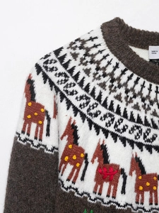 Detailed view of the thick jacquard knit sweater featuring Fair Isle horse pattern
