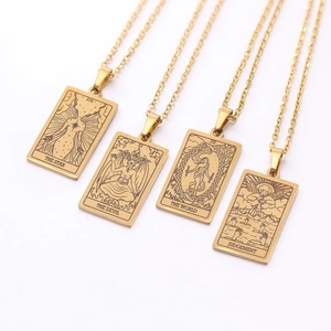 Detailed engraving of gold Tarot pendant necklaces featuring Star and World designs