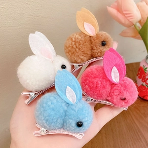 Set of four cute plush bunny hair clips in white, brown, blue and rose pink colors