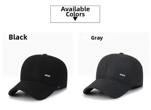 Detail view of thick winter wool baseball caps in black and dark grey with metal logos