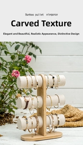 Three-tier bamboo jewelry stand with white velvet bars for watches and bracelets