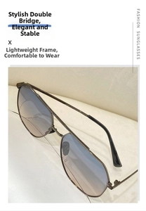 Detail of pilot sunglasses with double bridge metal frame and gradient blue lenses