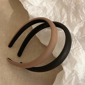 Minimalist leather padded headbands in black and khaki with a high top sponge design