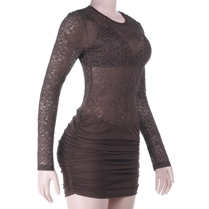 Detail of dark brown dress featuring lace hollow-out top and horizontal ruching textures