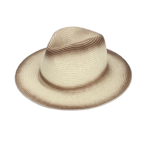 Detail of hand-woven straw panama hat showing the natural brown gradient on a wide brim