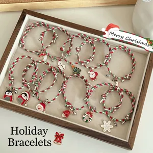 Set of 12 Christmas braided bracelets with enamel charms like Santa, snowman and deer