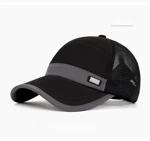 Detail of breathable mesh baseball cap in black with a grey accent and side brand label