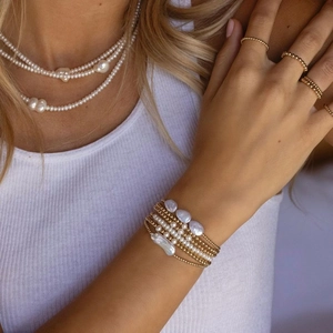 Baroque natural freshwater pearl bracelet with 18K gold beads in a layered style