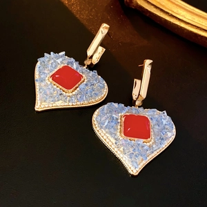 Vintage heart drop earrings with blue crystals and red square gems on black leather