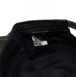 Detailed view of the 100% cotton care label inside the casual flat top military cap