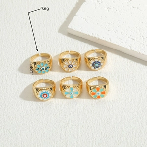 Set of 6 gold-plated evil eye rings with colorful enamel floral patterns on stone