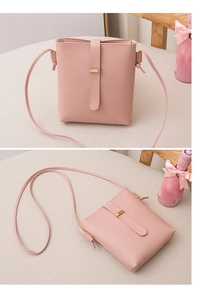 Detail view of pink PU leather crossbody phone bag with gold metal buckle decoration