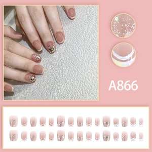 French nude press-on nails set A866 with silver glitter and white tips in short oval shape