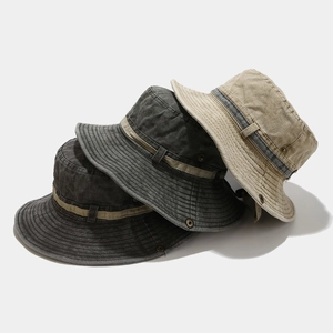 Detailed texture of washed cotton bucket hats with metal vents in multiple colors