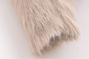 Close-up of soft apricot faux fur texture showing high density and smooth fibers