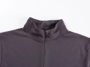Close-up of the stand-up collar and high-density knit fabric on a charcoal grey yoga top