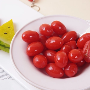 Realistic artificial cherry tomatoes in a ceramic bowl with decorative watermelon slices