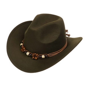 Detail view of dark green western cowboy hat featuring ethnic beaded band and felt texture