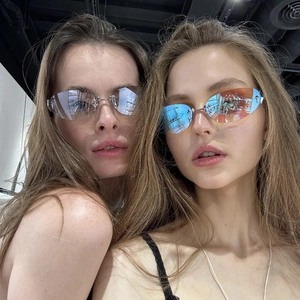 Y2K star frameless sunglasses with oval gradient lenses and silver cross metal detail