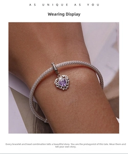 Close-up of a 925 silver mesh bracelet featuring a heart pendant with purple zircon