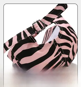 Detail of adjustable metal buckle and zebra print pattern on the back of the baseball cap