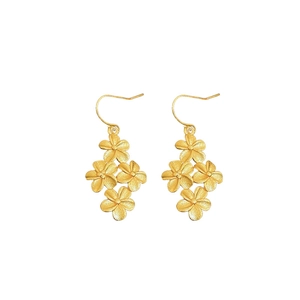 Elegant gold flower drop earrings with a matte metallic texture on a white background