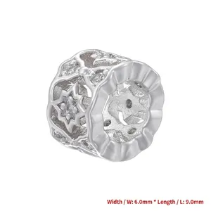 Detailed macro view of a 9mm x 6mm silver honeycomb spacer bead with star engravings