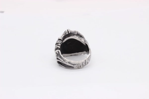 Macro detail of gothic skull ring back showing vintage oxidized silver texture and finish