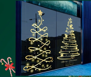 Detail of luxury golden Christmas tree window decals with elegant holiday lettering