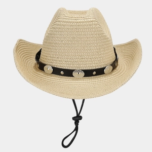 Detail of woven straw cowboy hat featuring metallic studs on black faux leather band