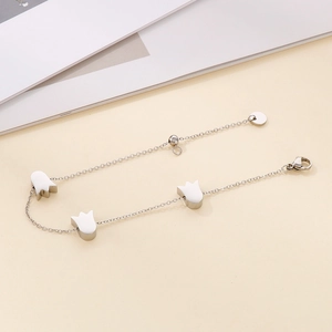 Detail of silver-tone tulip charm bracelet with O-link chain and adjustable lobster clasp