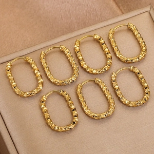 Polished golden stainless steel rectangular earrings with diamond-cut starry texture