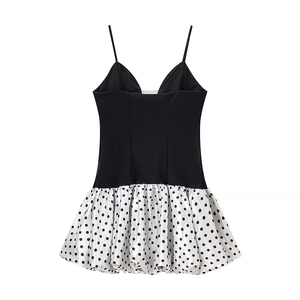Chic black V-neck camisole dress with contrast white polka dot skirt and slim fit design