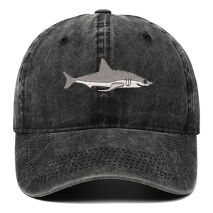 Macro view of high-quality shark embroidery on washed cotton vintage baseball cap